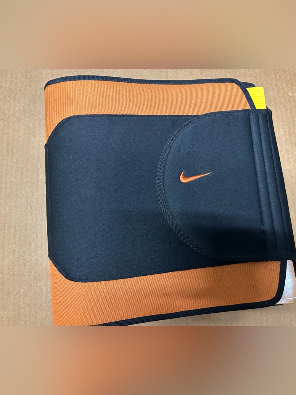 Nike 3 ring binder w/ 2 Nike folders.  Orange & black. Adhesive closure.